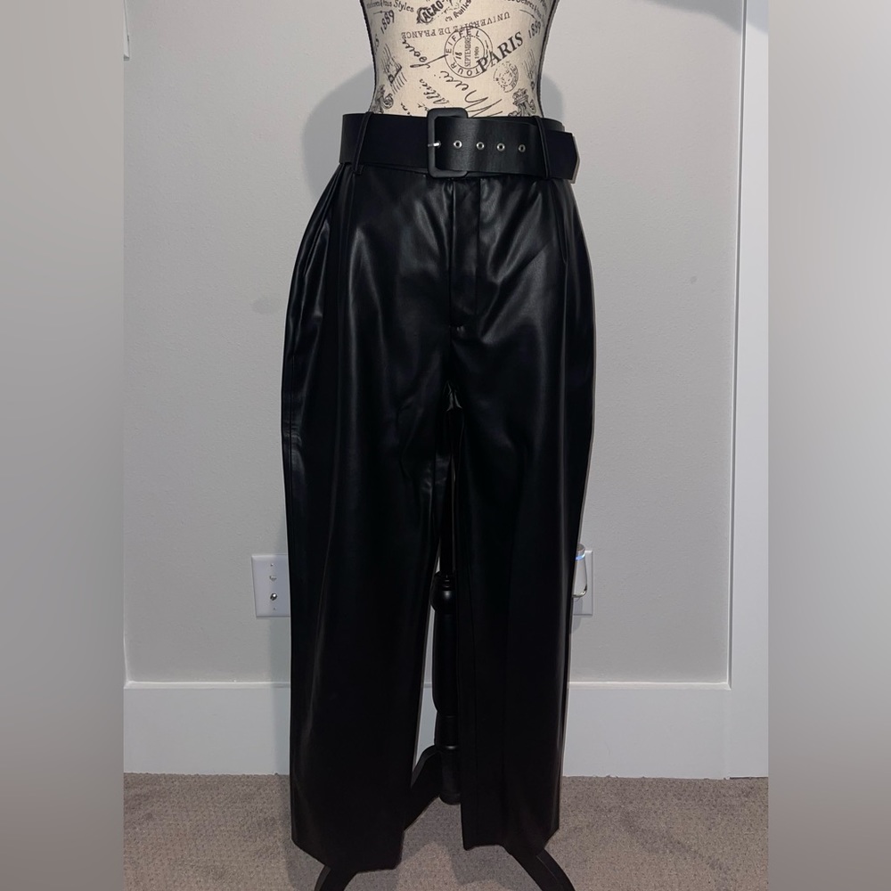Black faux leather pants with belt
